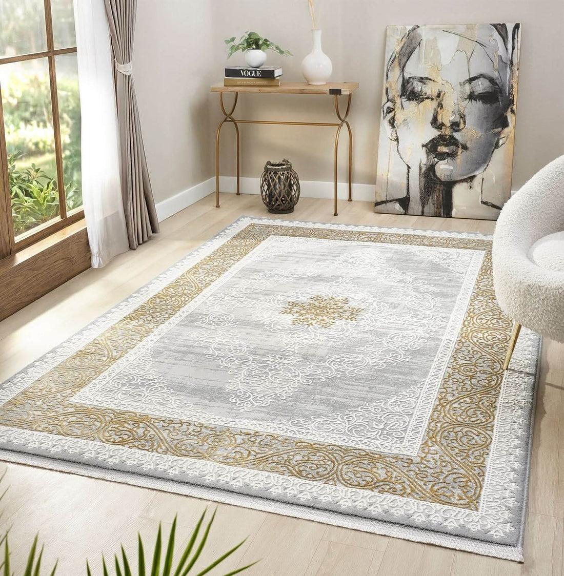 Grey and gold Kervan rug styled with neutral living room furniture