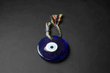 Evil Eye Hanging This Evil Eye is the perfect way to protect yourself from negative energy. Featuring the traditional symbol of the evil eye, this unique decor adds a touch of beauty to your home while keeping you safe. An ideal and thoughtful gift for so