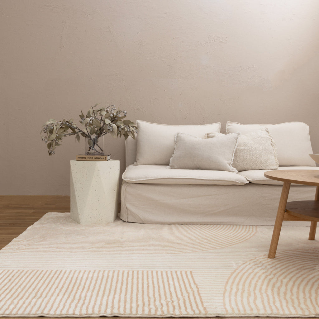 Cloud Arches Cream Beige Washable Rug styled with furniture