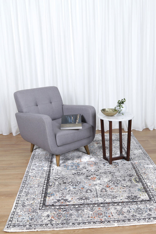 Almeras 23647-110 Grey Multicolour Floral Border Rug styled with furniture