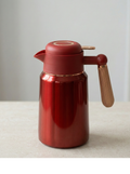 2L Vacuum Bottle Stainless Steel in red, designed to keep beverages hot or cold with an insulated body.