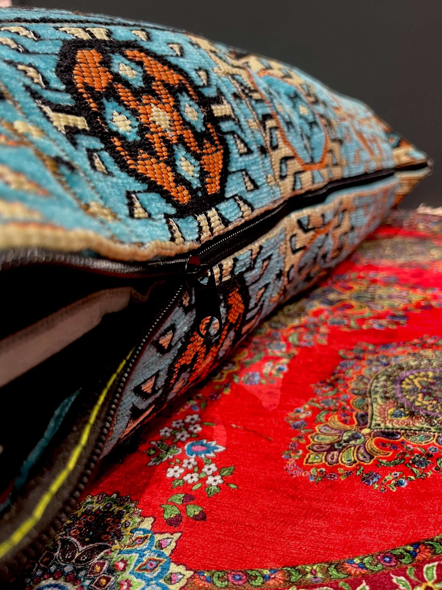 Traditional Turkish Pillow Cushion 50x60 in aqua diamond pattern resting on a vibrant red backdrop.