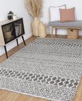 Amritsar Ramdass Charcoal & Beige Cotton Blend Rug styled with furniture