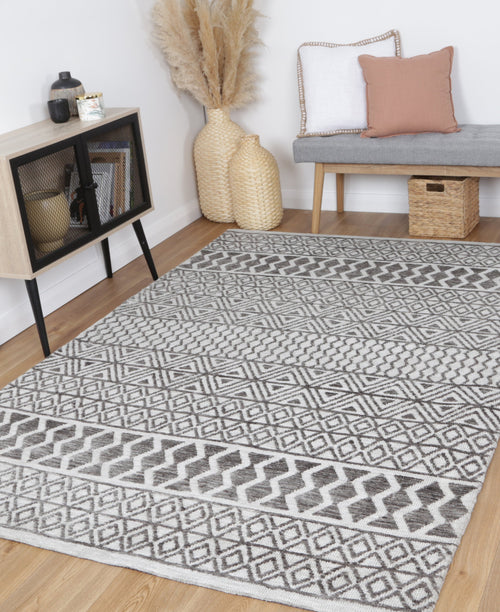 Amritsar Ramdass Grey Cotton Blend Rug styled with furniture