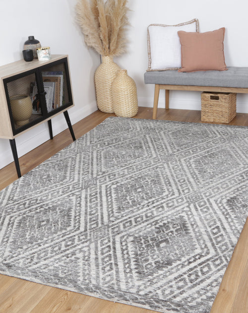 Amritsar Majitha Charcoal & Beige Cotton Blend Rug styled with furniture