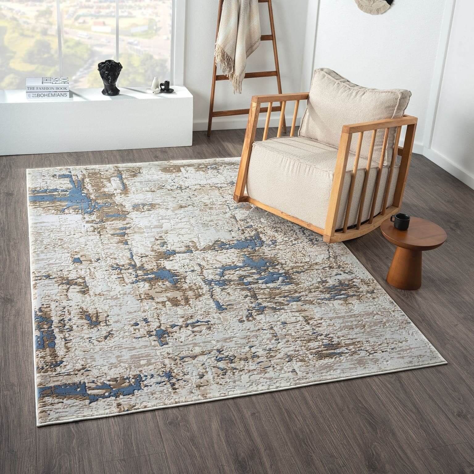 Abstract Modern Turkish Rugs Fable 475 Arctic in a contemporary living room setting with a wooden chair.