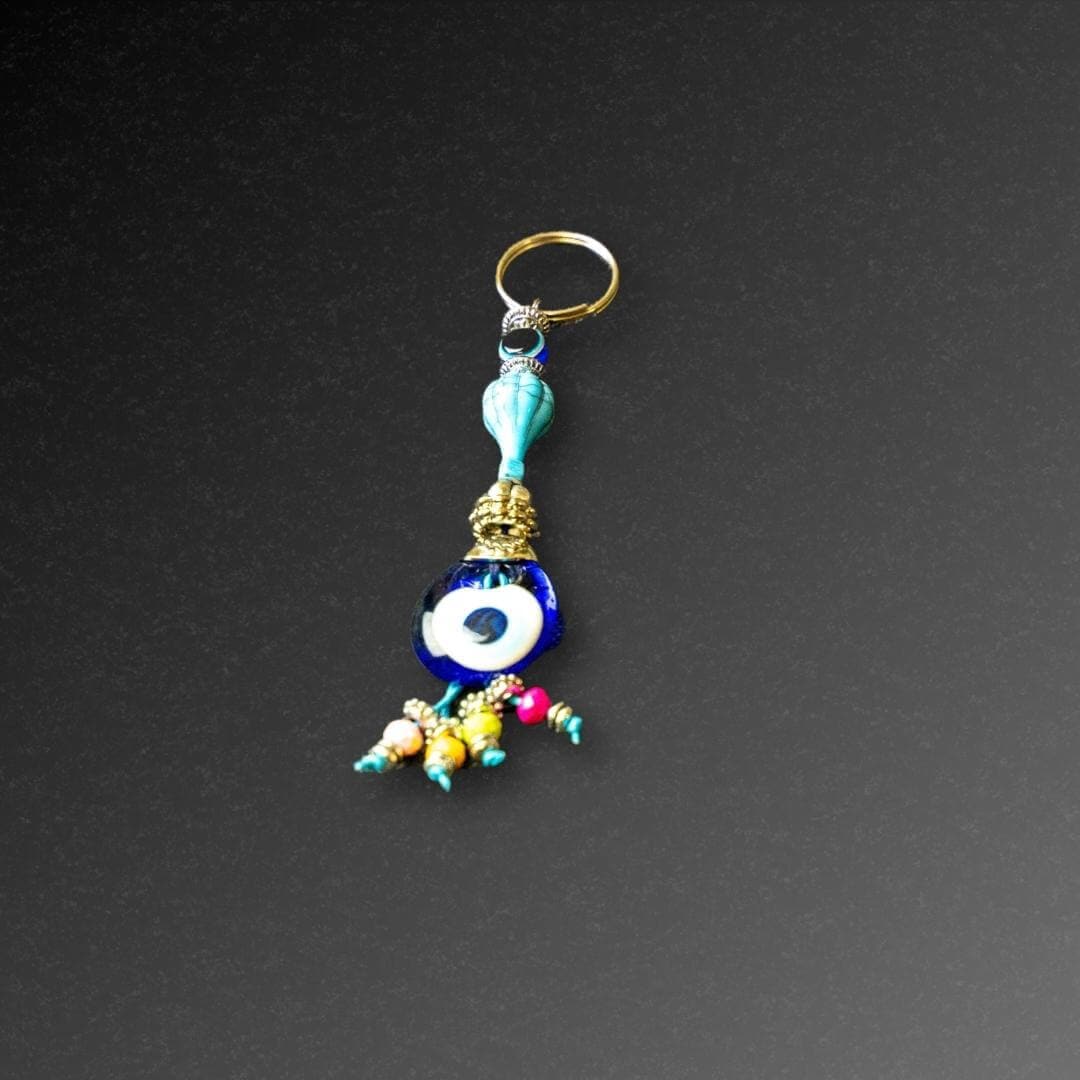 Aqua Bead Evil Eye Keyring-The Evil Eye Keyring is a symbol that protects from negative energy, harm, illness, and evil spirits. It has been around for 5000 years in various cultures and is also referred to as nazar, cheshm nazar, chashm-e-baddoor, nazar