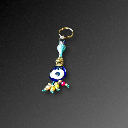 Aqua Bead Evil Eye Keyring-The Evil Eye Keyring is a symbol that protects from negative energy, harm, illness, and evil spirits. It has been around for 5000 years in various cultures and is also referred to as nazar, cheshm nazar, chashm-e-baddoor, nazar