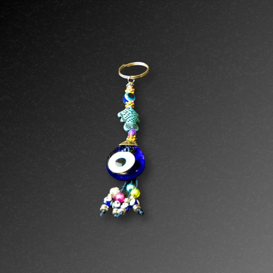 Aqua Fish Evil Eye Keyring-The Evil Eye Keyring is a symbol that protects from negative energy, harm, illness, and evil spirits. It has been around for 5000 years in various cultures and is also referred to as nazar, cheshm nazar, chashm-e-baddoor, nazar