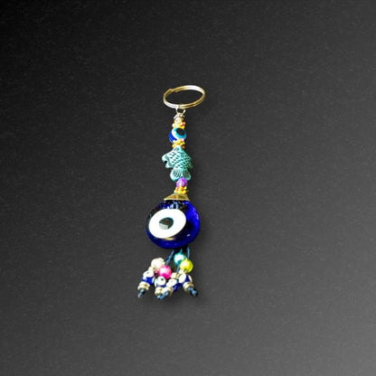 Aqua Fish Evil Eye Keyring-The Evil Eye Keyring is a symbol that protects from negative energy, harm, illness, and evil spirits. It has been around for 5000 years in various cultures and is also referred to as nazar, cheshm nazar, chashm-e-baddoor, nazar