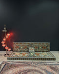 Arabian Majlis Divan Set in a stylish living space with traditional patterns and elegant floor cushions.
