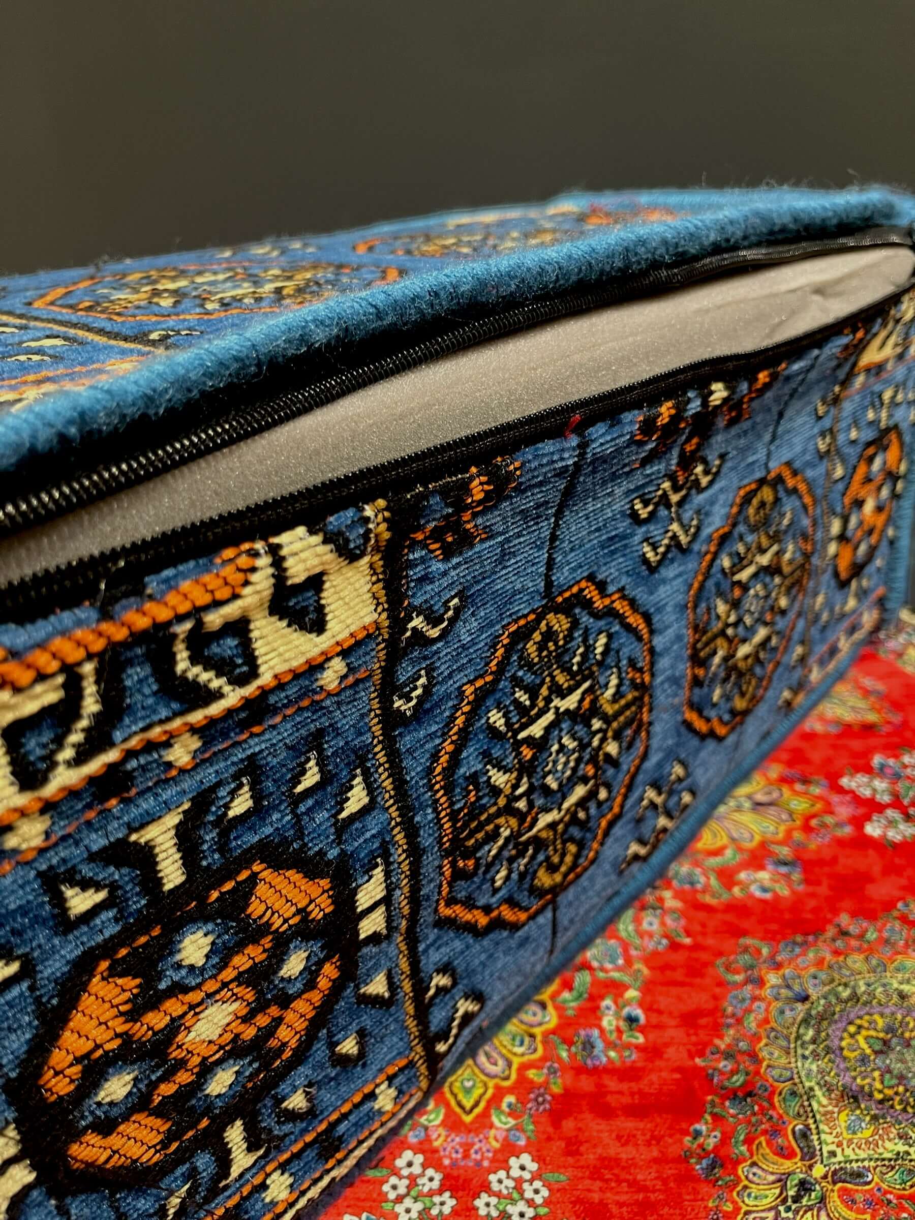 Traditional Turkish Armrest Cushion showcasing vibrant blue and orange patterns on quality fabric.