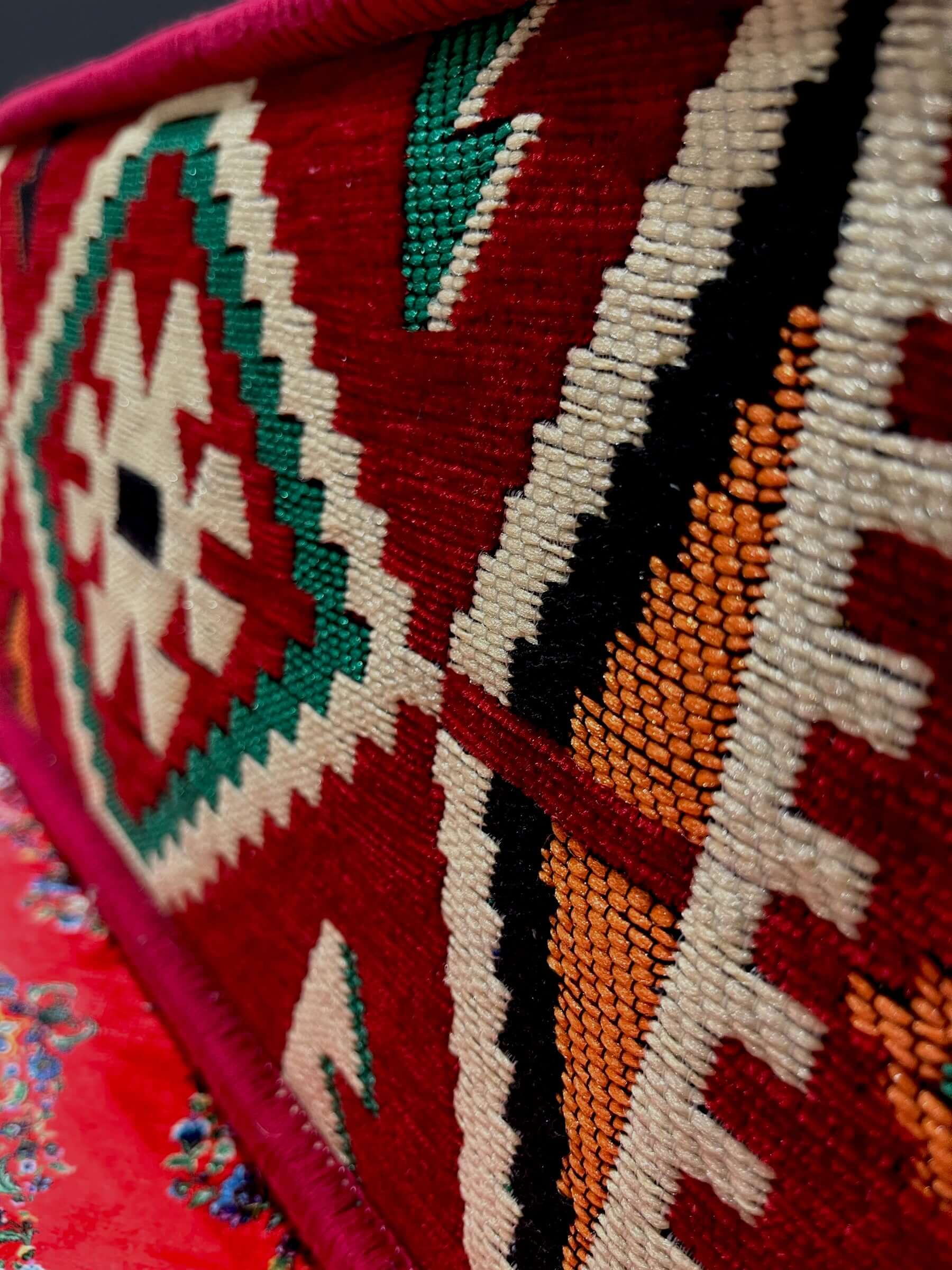 Traditional Turkish Armrest Cushion side view showcasing intricate red and colorful patterned fabric.