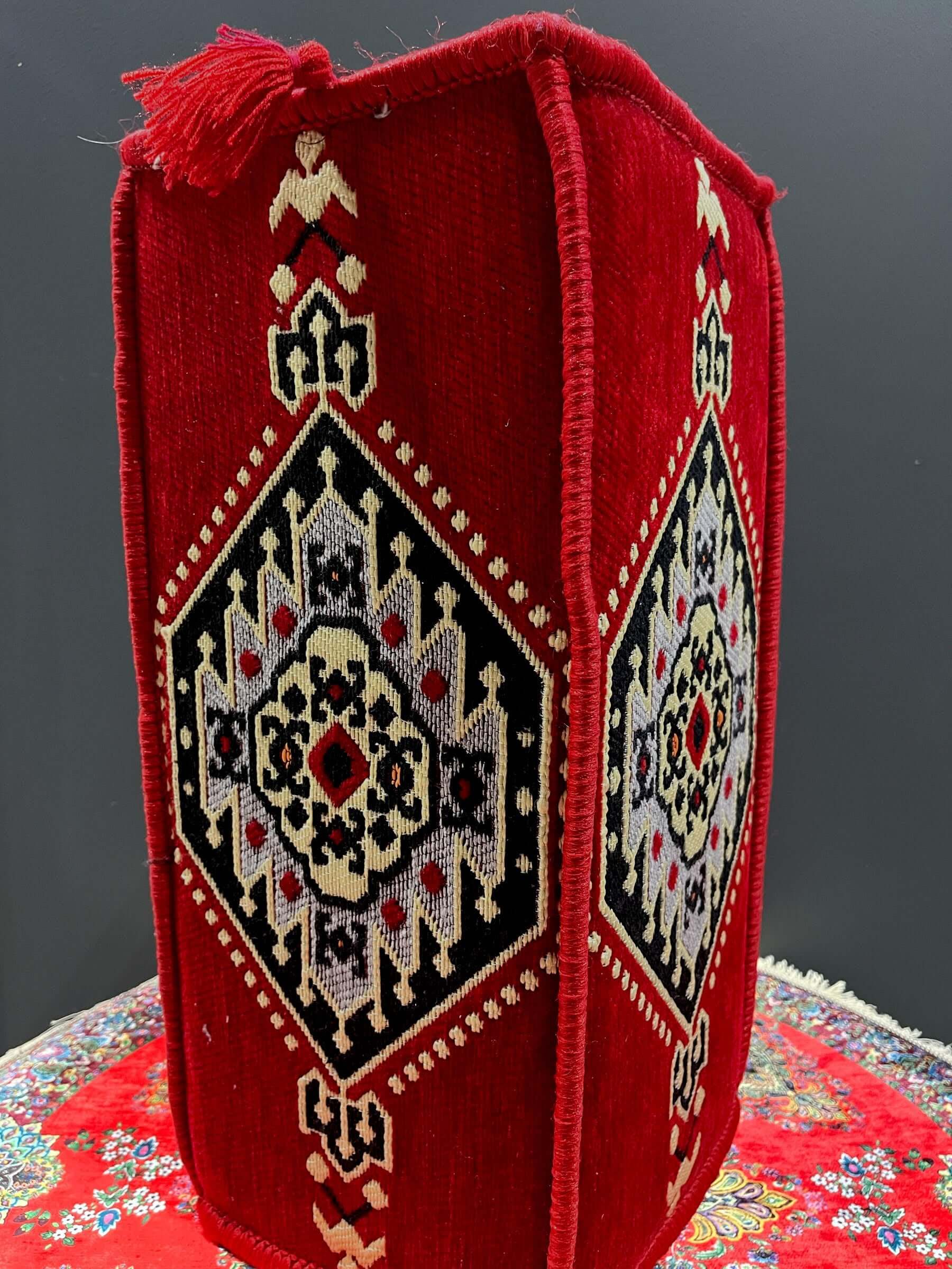 Traditional Turkish Armrest Cushion with colorful patterns and textures in red and black.