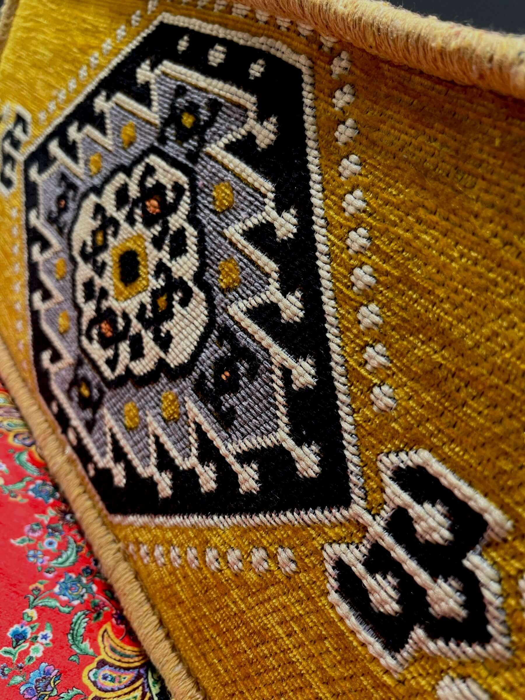 Traditional Turkish Armrest featuring vibrant yellow and intricate black embroidery detail.