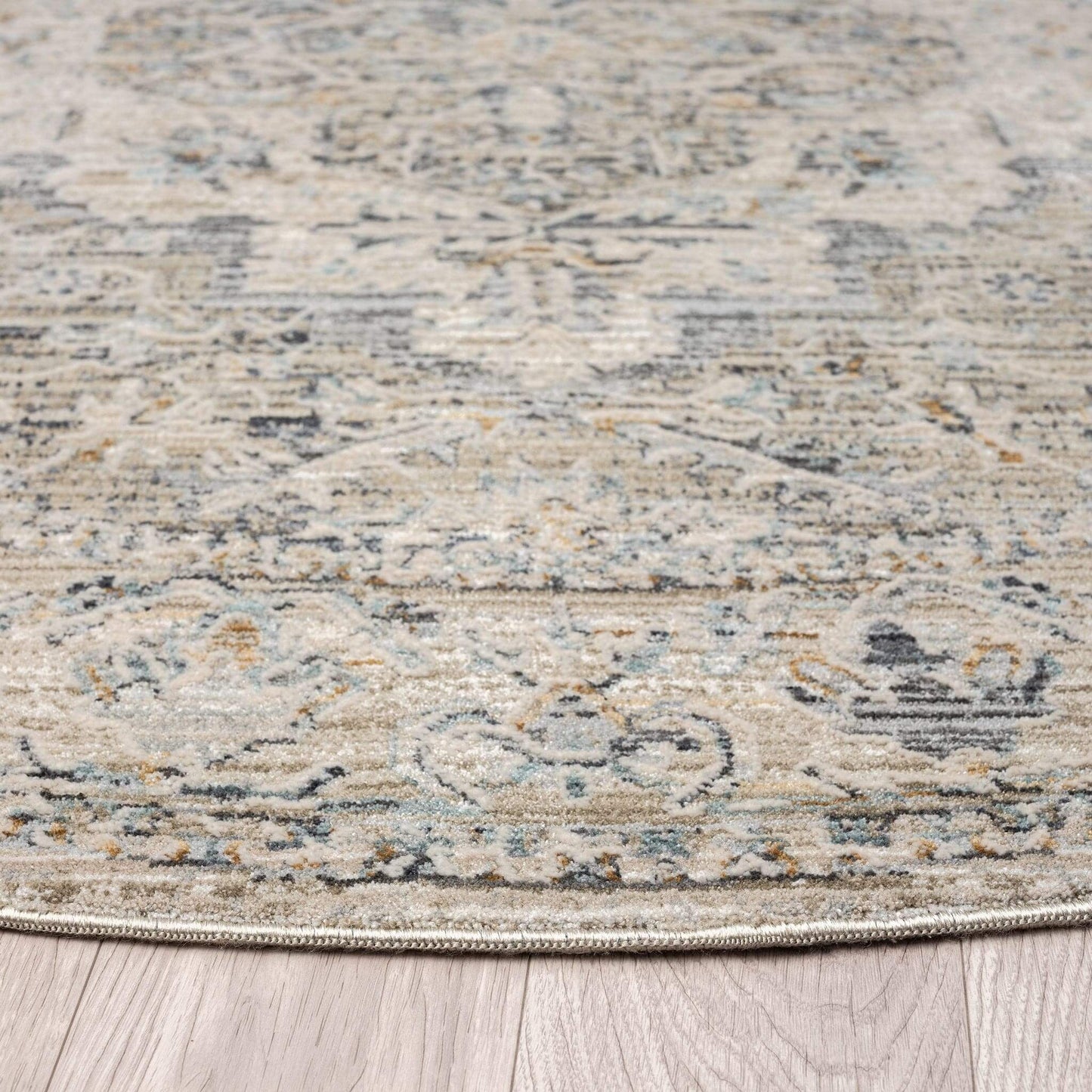Aubrey 6753 Taupe Round-This exquisite collection has all the hallmarks of a perfect combination of design, colour and texture. The modern take on traditional oriental patterns in this superb range are reflected beautifully on a durable, cross-woven pile