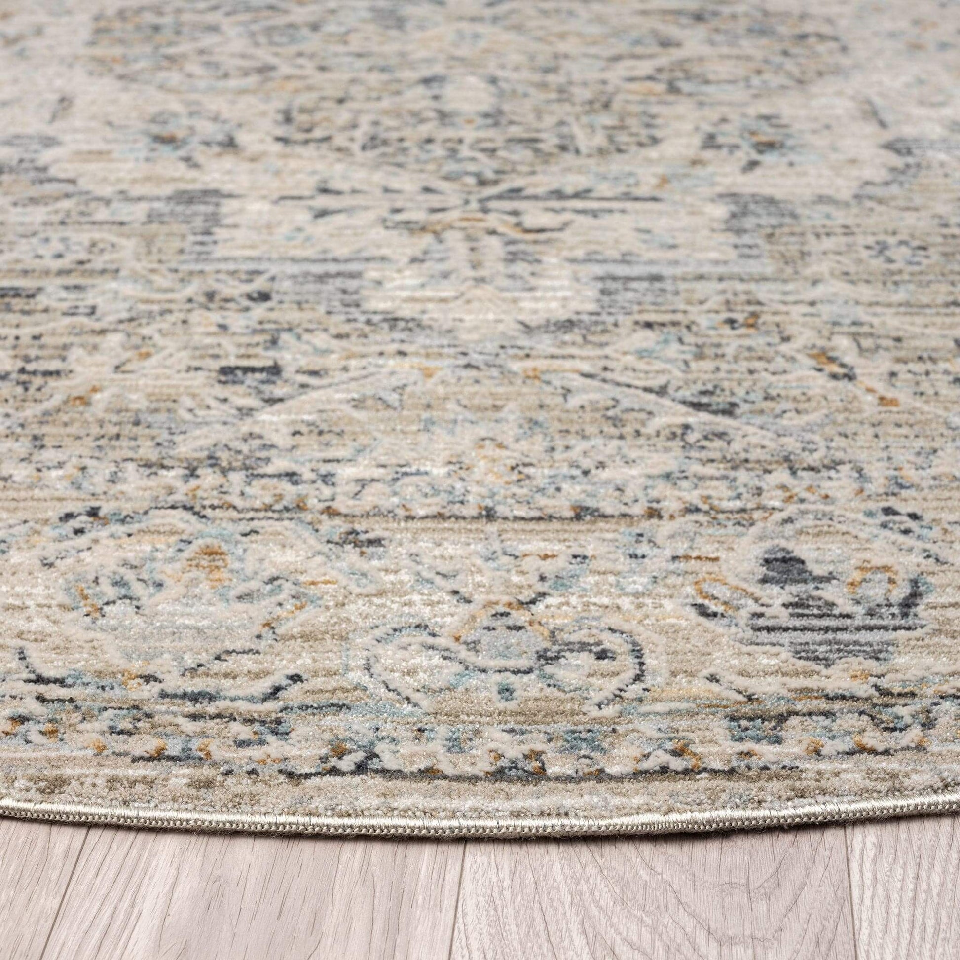 Aubrey 6753 Taupe Round-This exquisite collection has all the hallmarks of a perfect combination of design, colour and texture. The modern take on traditional oriental patterns in this superb range are reflected beautifully on a durable, cross-woven pile