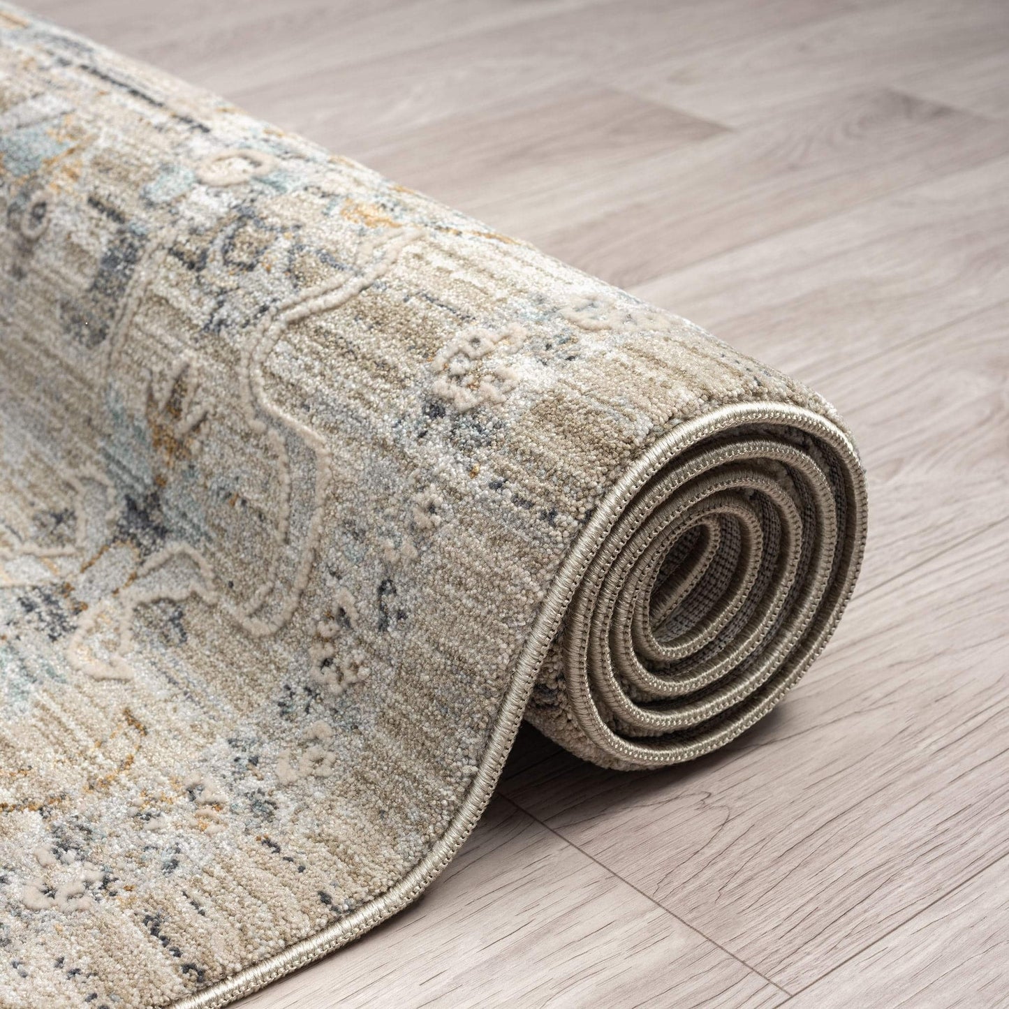 Aubrey 6755 Taupe-This exquisite collection has all the hallmarks of a perfect combination of design, colour and texture. The modern take on traditional oriental patterns in this superb range are reflected beautifully on a durable, cross-woven pile using
