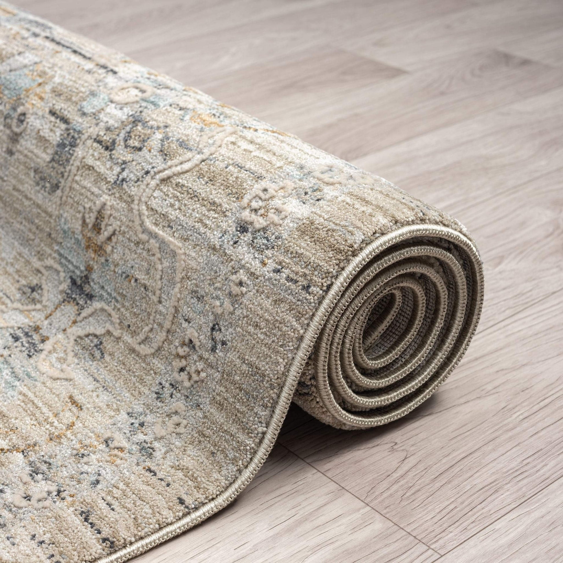 Aubrey 6755 Taupe-This exquisite collection has all the hallmarks of a perfect combination of design, colour and texture. The modern take on traditional oriental patterns in this superb range are reflected beautifully on a durable, cross-woven pile using