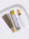 Aura Healing Incense Sticks with packaging and incense sticks arranged on a plate.