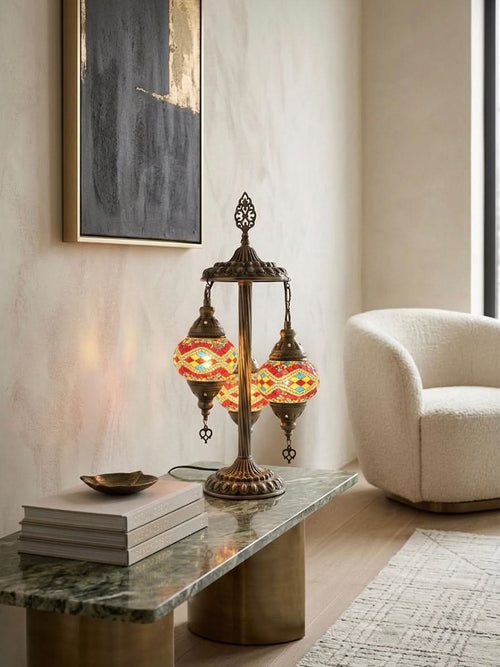 Authentic 3-Globe Turkish Mosaic Table Lamp with red, blue, and yellow diamond patterns in a cozy living room.