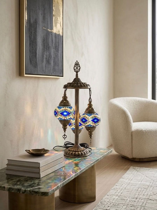 Authentic Turkish mosaic table lamp with 3 globes casting colorful light in a stylish living room decor.