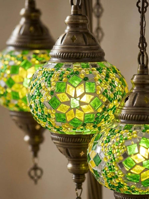Handcrafted Turkish mosaic table lamp with three globes in green and yellow glass, featuring intricate geometric designs.