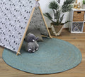 Organica Tundra Blue Jute Round Rug styled with furniture