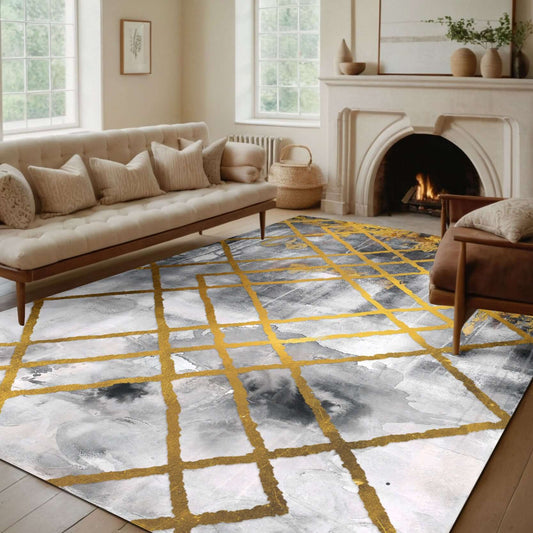 Golden Grid Elegance Rug Transform your living space with the Golden Grid Elegance Rug, featuring a stunning abstract design of soft gray and white hues intersected by golden grid lines. This modern yet timeless rug adds a sophisticated touch to any home