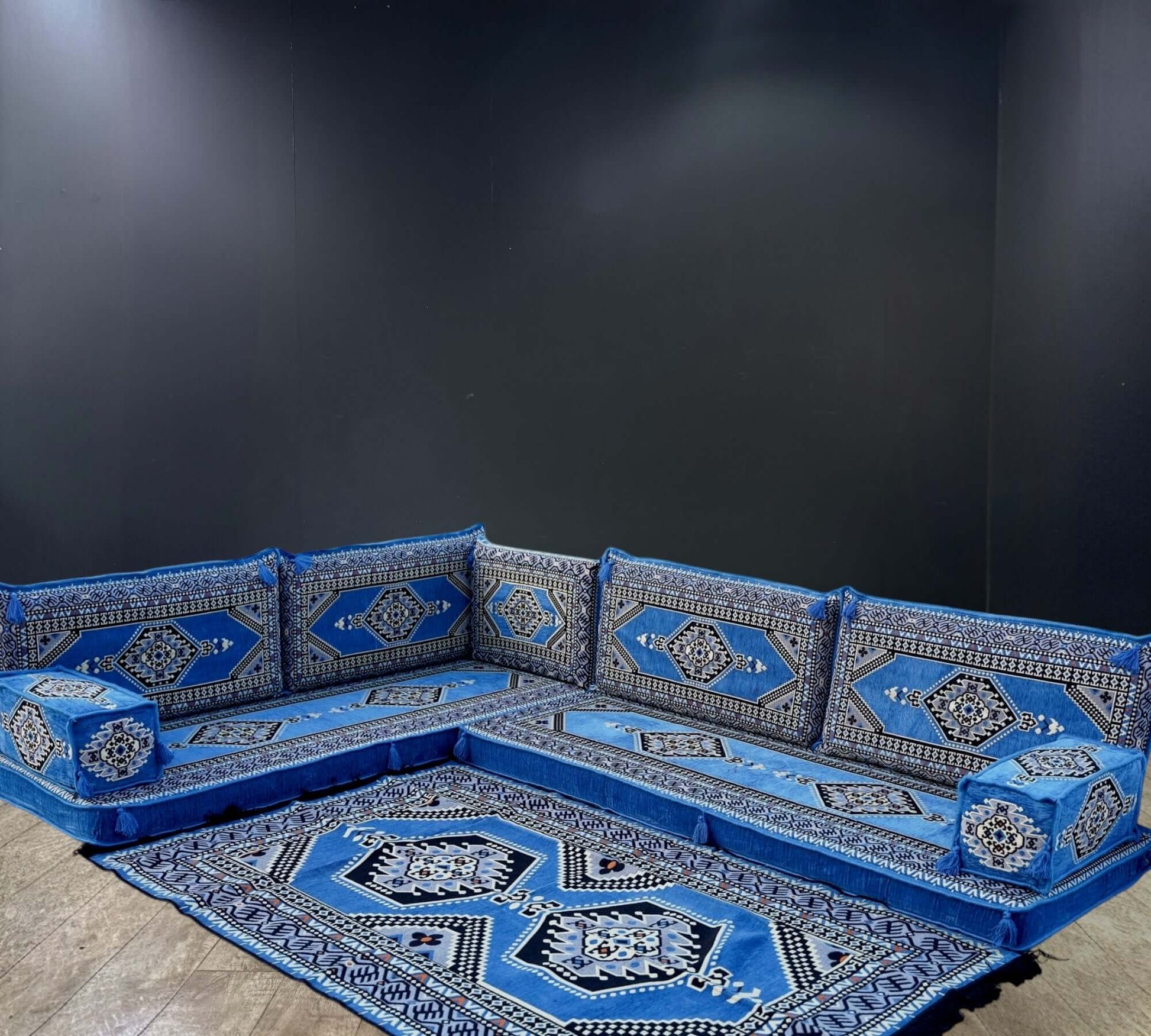 Blue Palace Arabian Majlis L-Shape Sofa Set,Redefine luxury with the Blue Palace Arabian Majlis L-Shape Sofa Set. Rich blue hues, 100% cotton covers, firm sponge, and a matching rug for a royal ambiance.