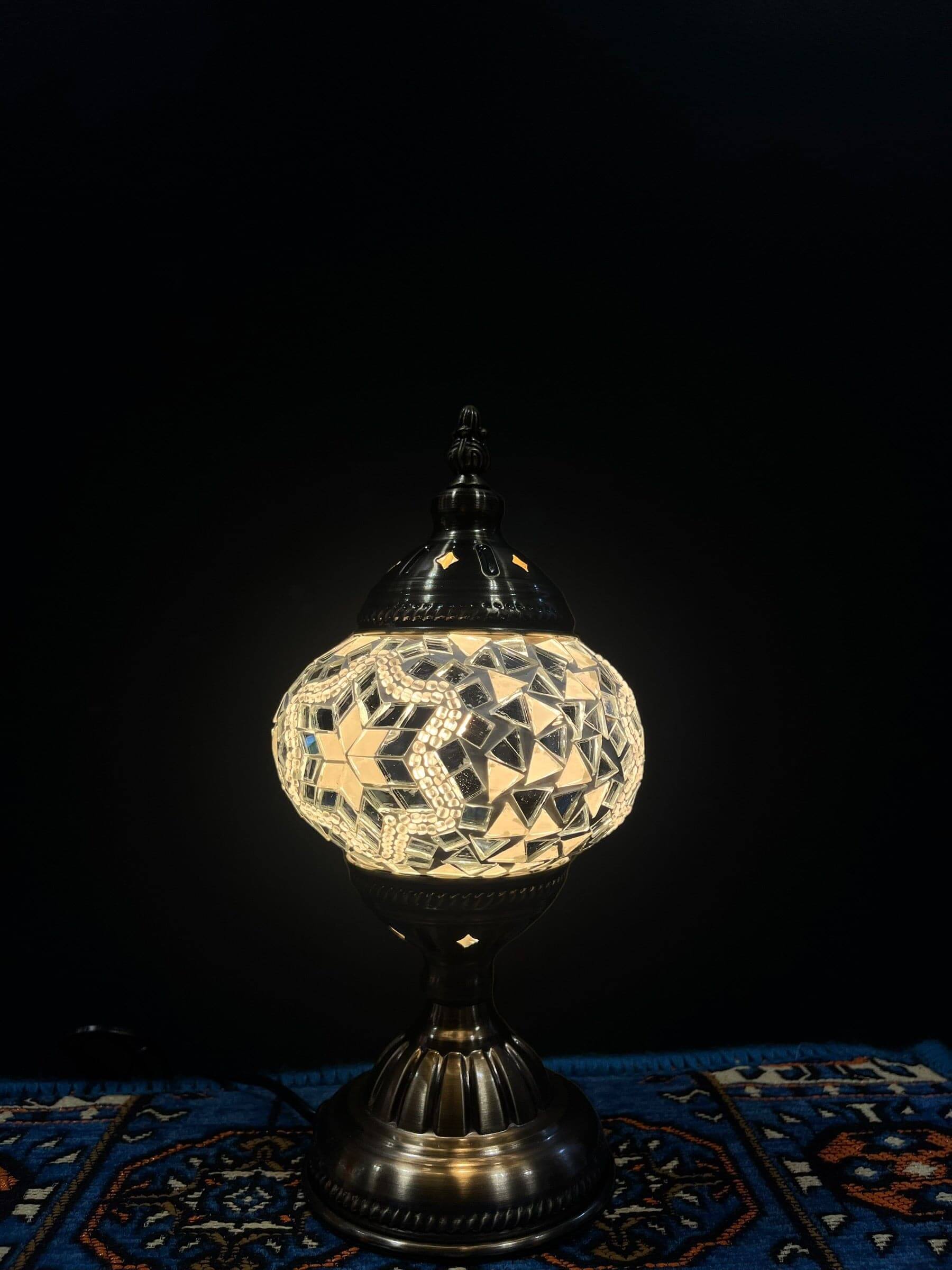 Mosaic Table Lamp with intricate glass design illuminating a beautiful glow, perfect for decor.