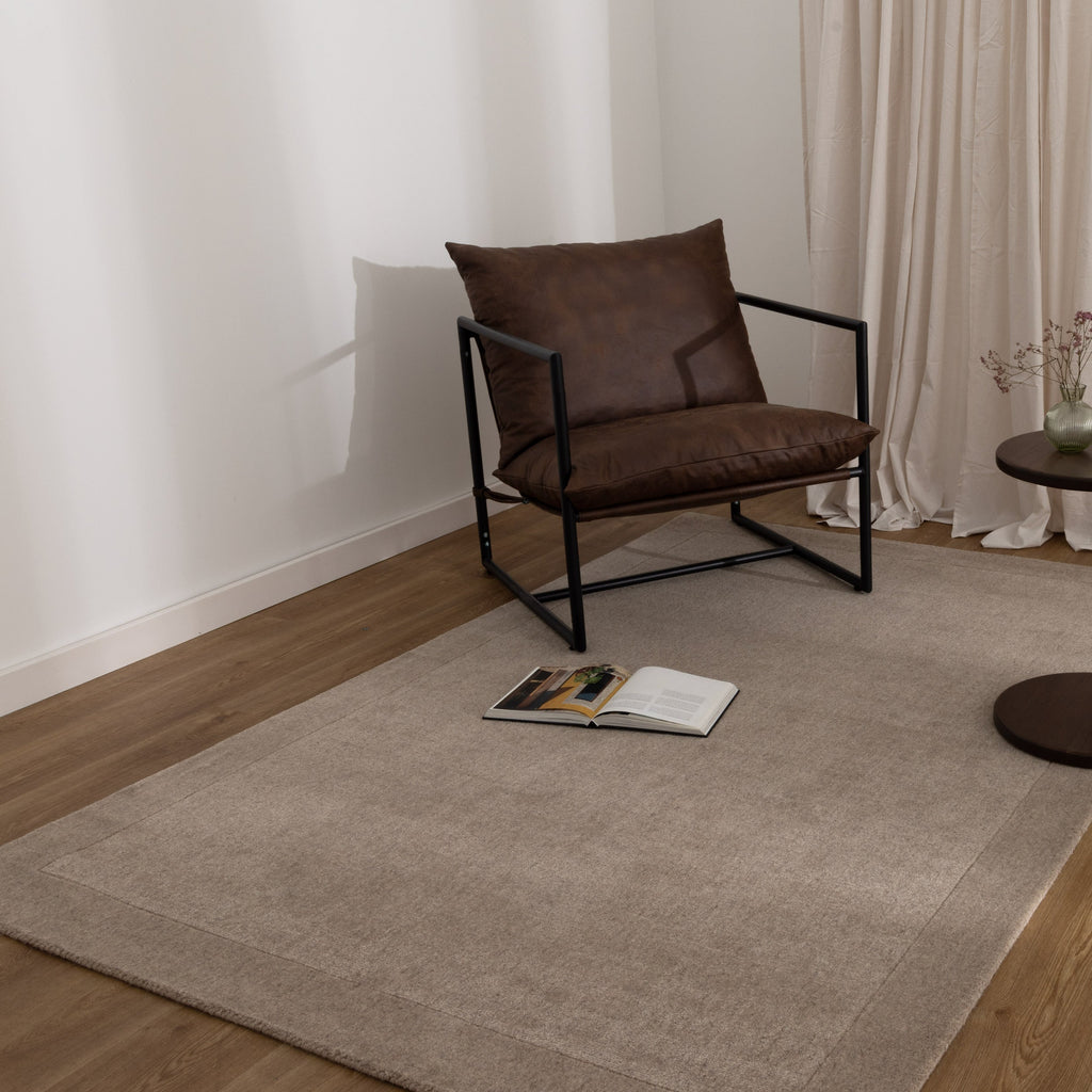 Sedona Camel Border Wool Blend Rug styled with furniture
