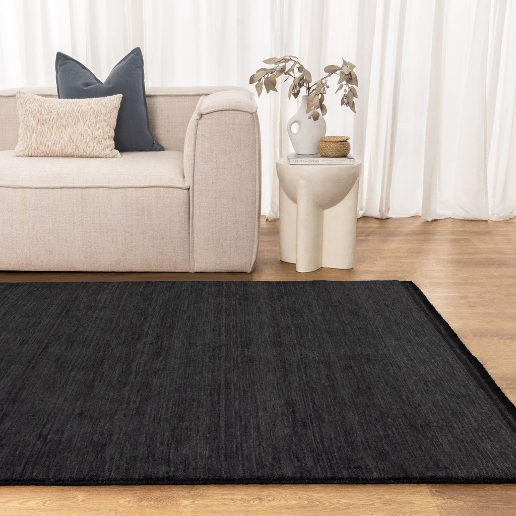 Charleston Hand-Knotted Wool Rug Charcoal styled with furniture