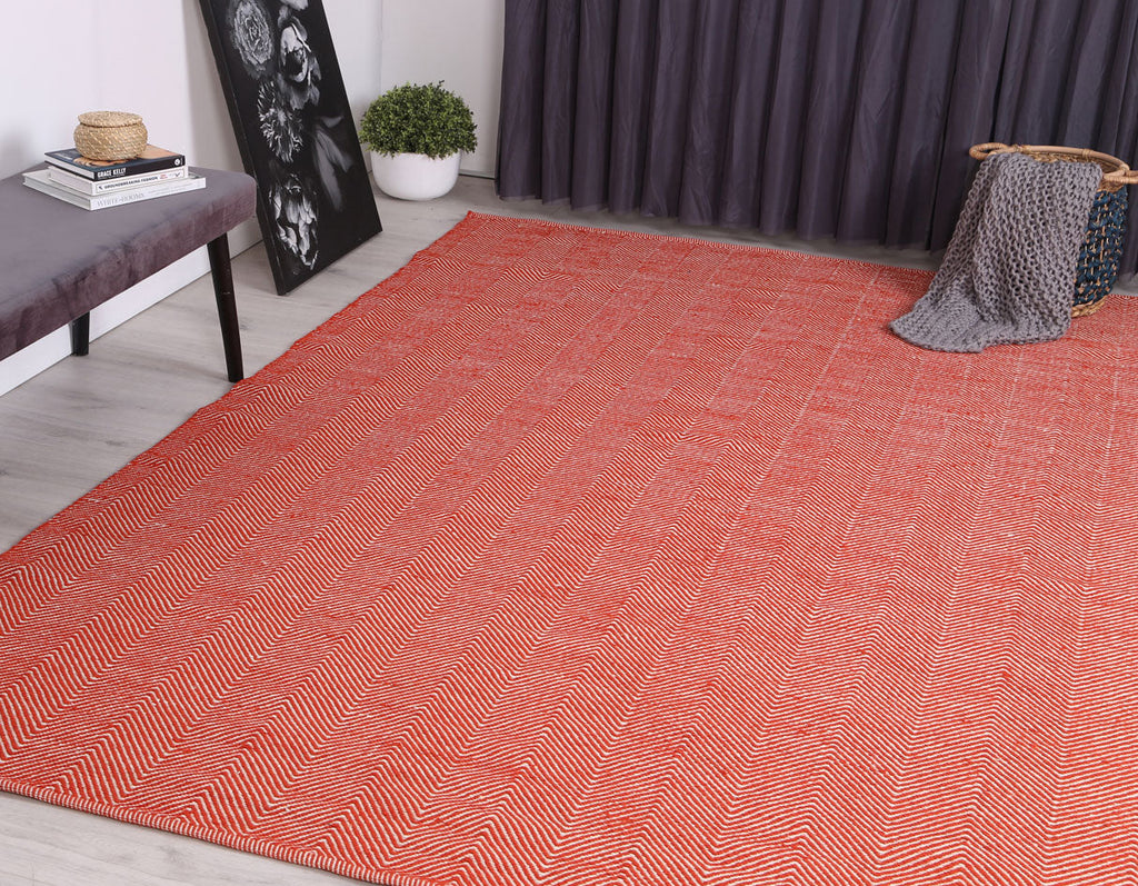 Bondi Chevron Tamarind and White Wool Blend Rug styled with furniture