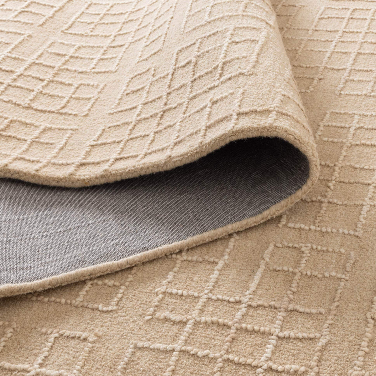 Abasco Croissant Beige Knitted Wool Rug texture