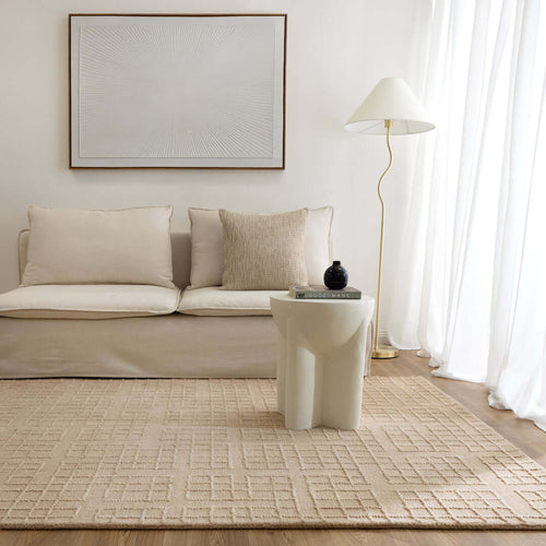 Abasco Croissant Beige knitted wool rug in a neutral living room