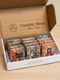 Compact Folding Mirror Keychain displayed in a box featuring artistic cat designs and patterns.