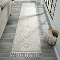 Cottage 548 Sand Runner rug displayed in a modern living room with geometric motifs and braided fringes.