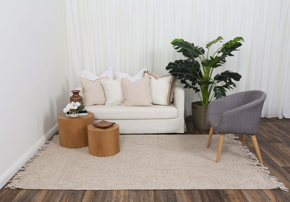 Diego Geometric Brown Wool Rug styled in a furnished living room