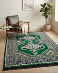 Turkish Kilim Rug showcasing the Green Palace pattern in a modern living space with a cozy chair and plant.