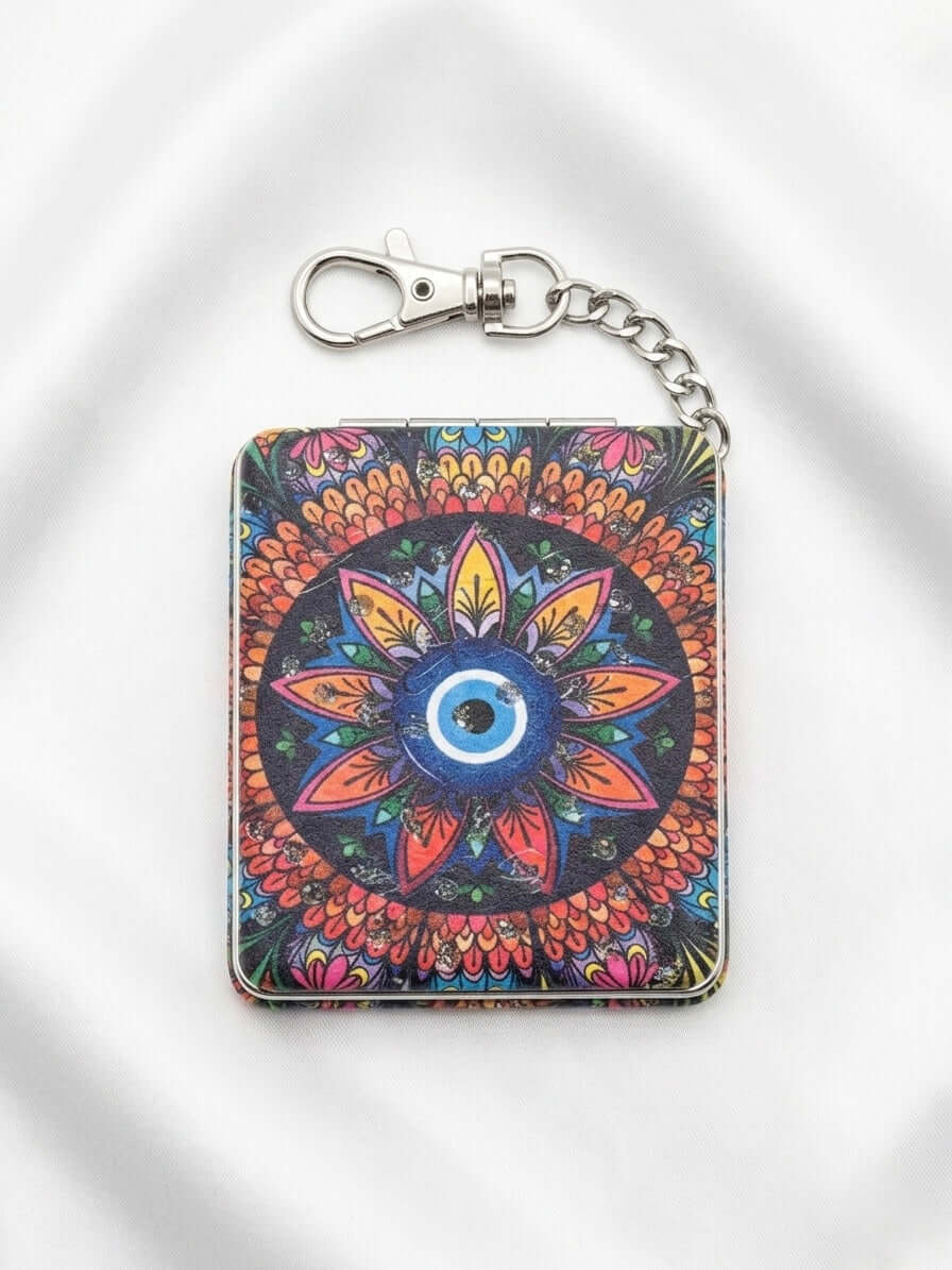 Evil Eye Compact Mirror Keychain featuring vibrant traditional patterns and the iconic evil eye symbol.
