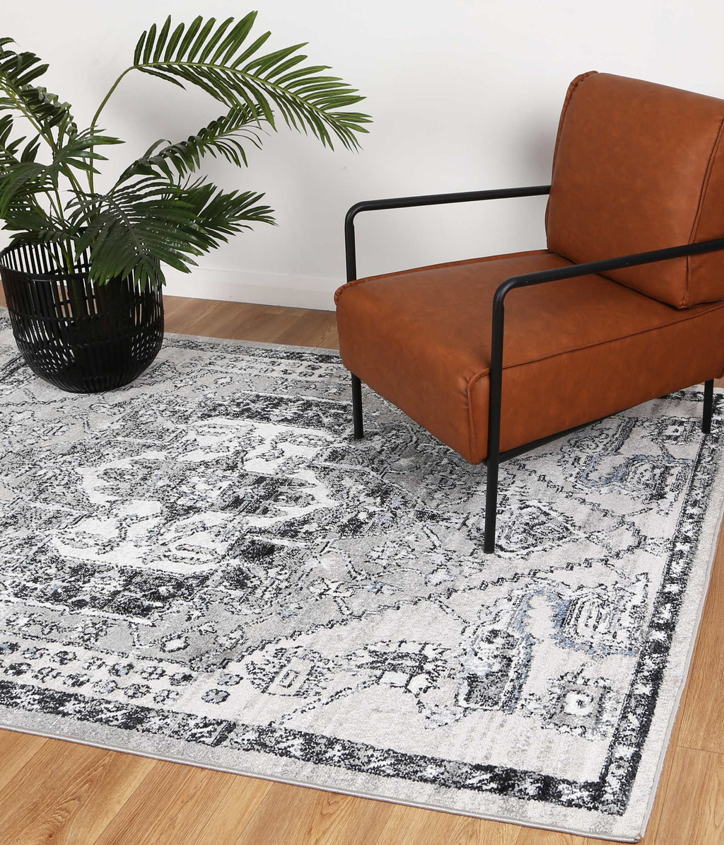 Estate Lynnwood Hall Traditional Grey Rug - 05GREY styled with furniture