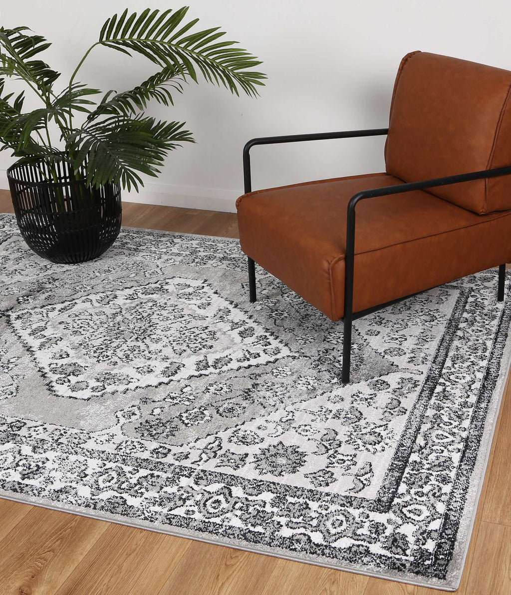 Estate Safra Traditional Grey Rug - 09GREY styled with furniture