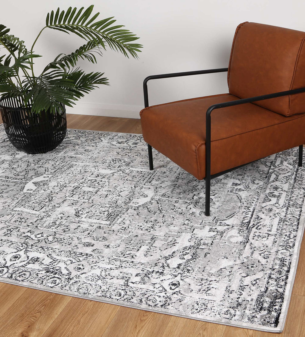 Estate Vatuvara Traditional Grey Rug - 19GREY styled with furniture
