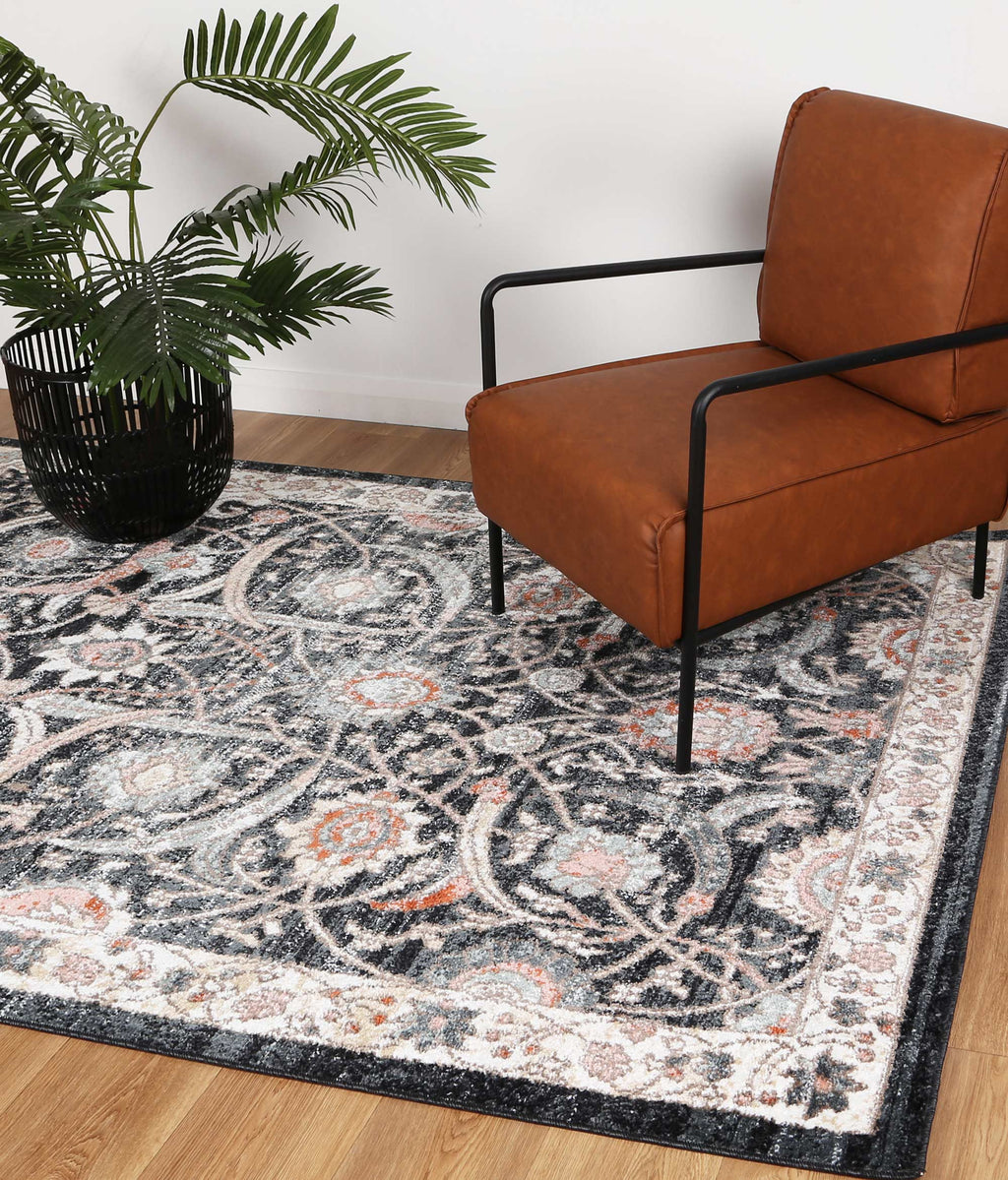 Estate Mylestone Traditional Charcoal Rug - 20CHAR styled with furniture
