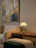 Elegant cordless bedside lamp on a wooden table with cozy decor in a stylish living space.