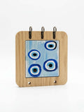 Evil Eye Key Holder: 15x15cm wooden rack with blue eye design for organizing keys and adding decor.