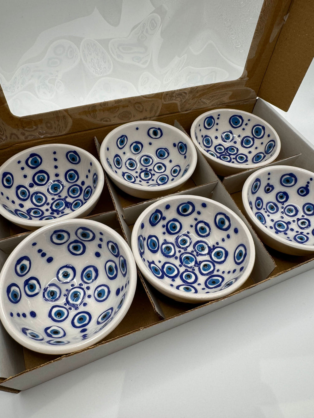 Evil Eye Turkish Ceramic Mini Bowls in a gift box, featuring blue Nazar motifs on white glaze, perfect for serving or decoration.