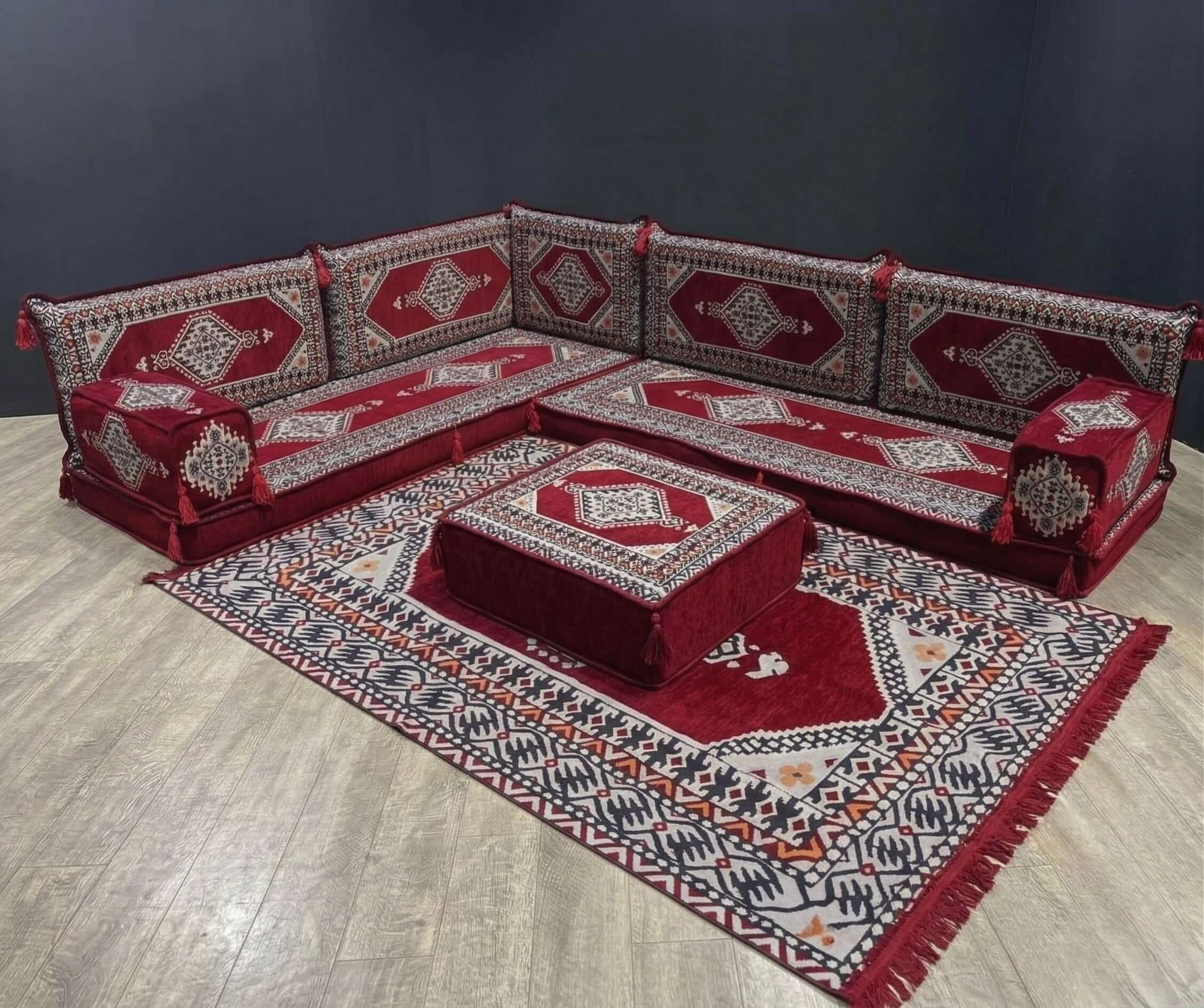 Maroon Palace L-Shape Full Set with Arabian Majlis design, showcasing elegant seating and a patterned rug.