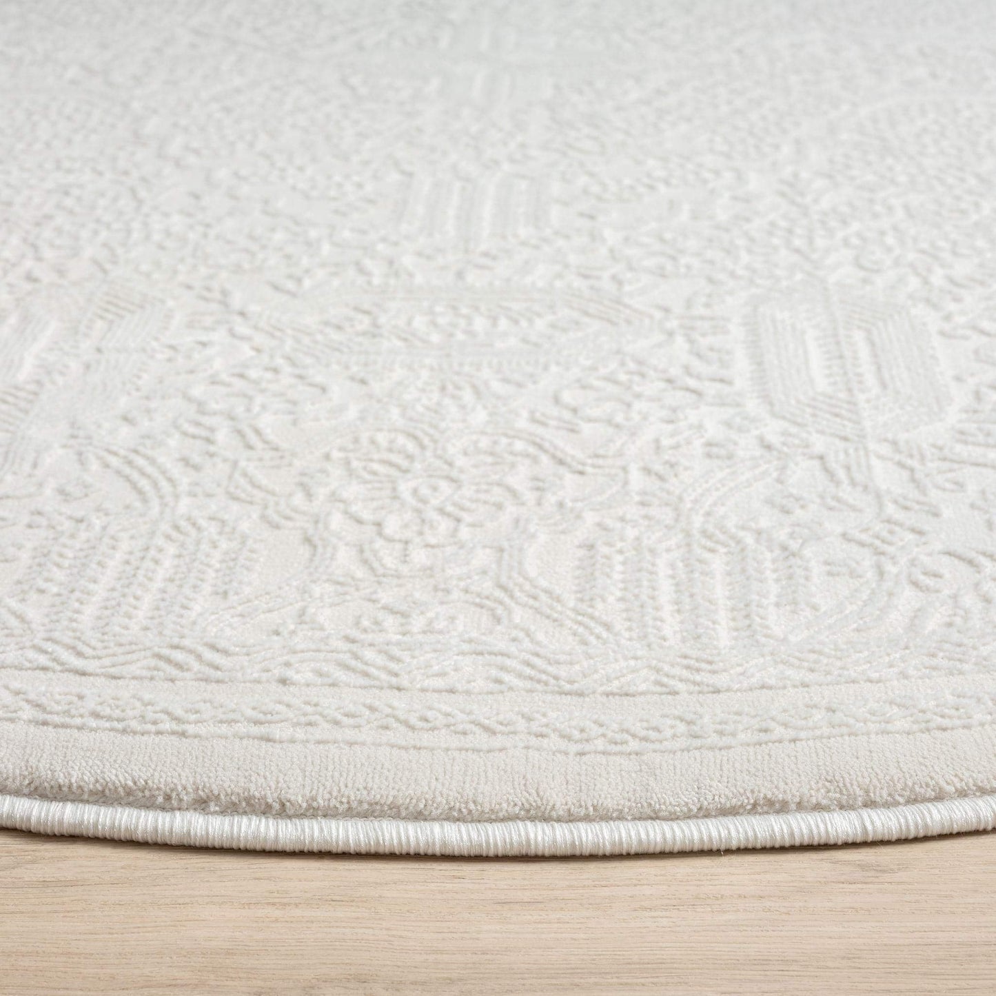 Fable 471 Ivory Round-This serene collection, with its muted tones and patterns, brings harmony and luxury to your floors while being restful for the eyes. The highly decorative and beautifully textured pile is made from polyester and polypropylene, power